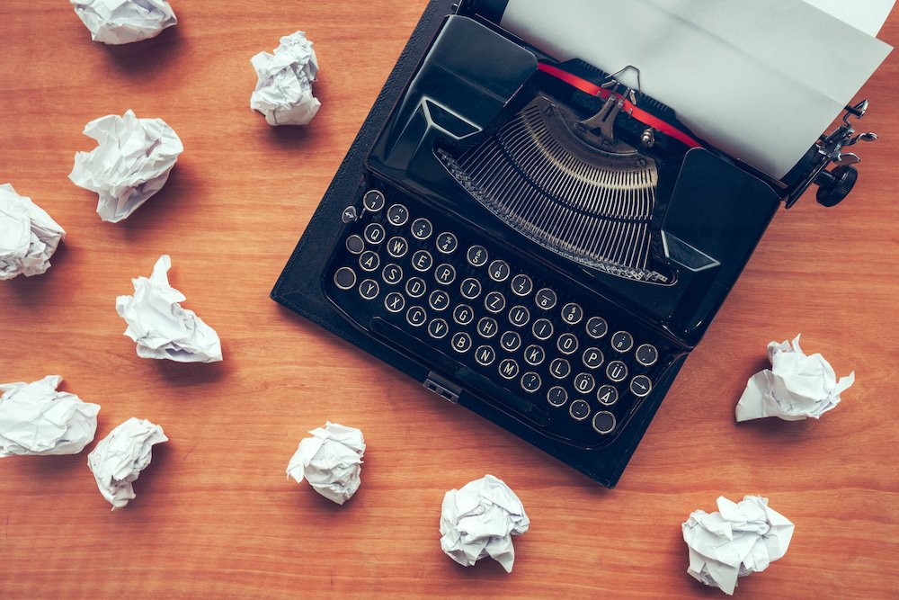 writers block image, typewriter with pages